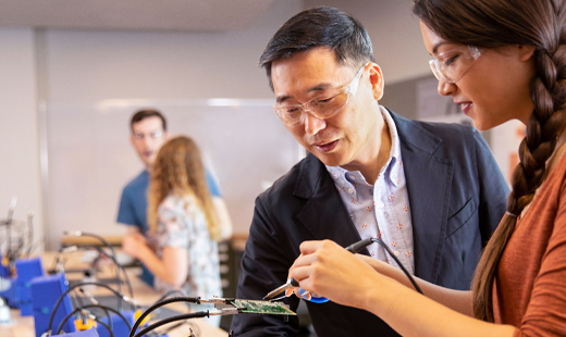 Students using soldering wires